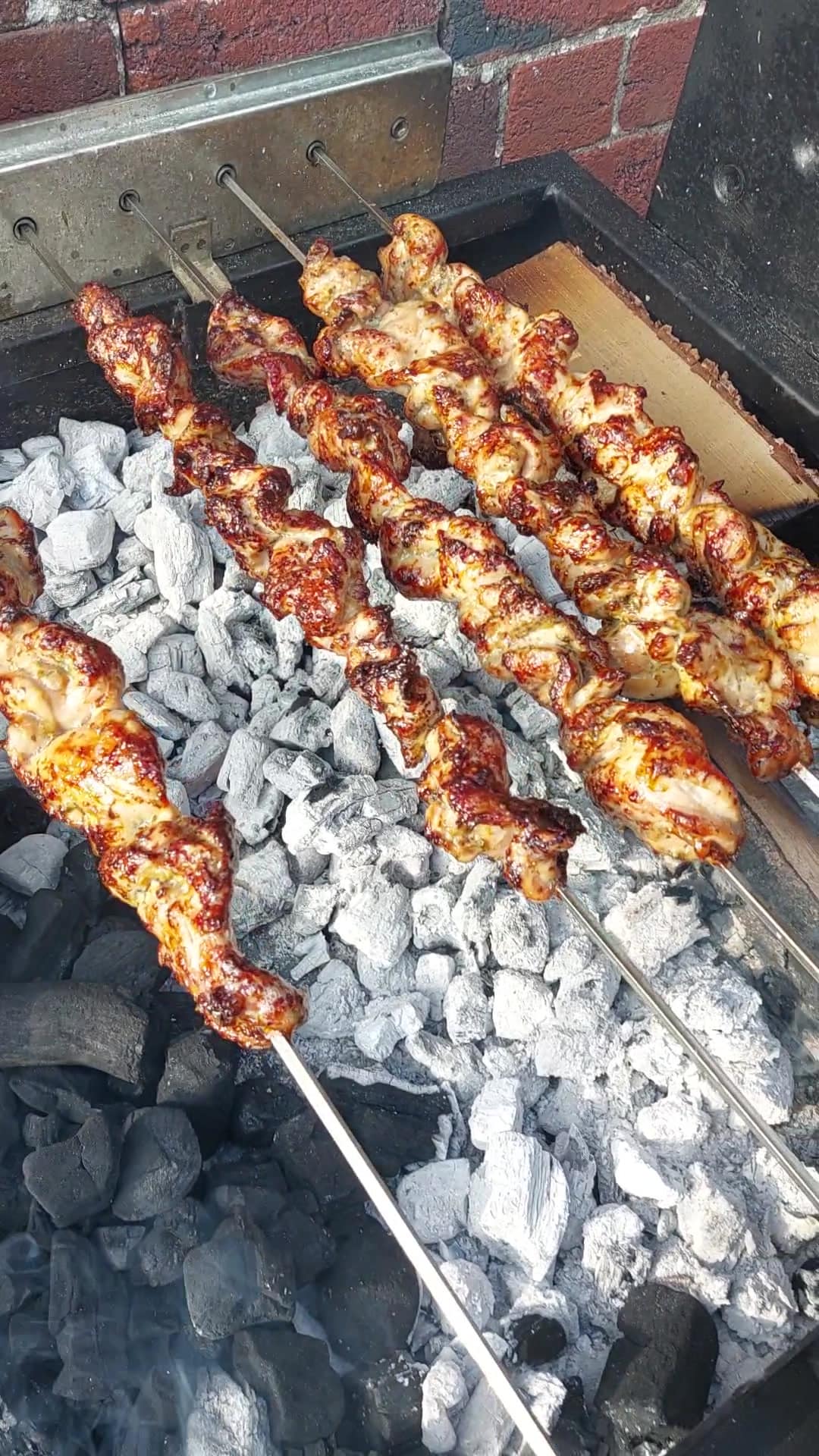 Glazed meat skewers charring over charcoal at a Yorkshire garden party — Jack Robinson Catering BBQ